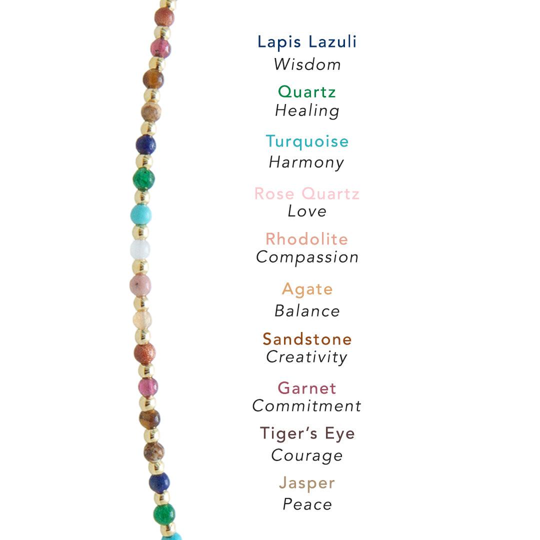 Dainty bracelet with assorted multi-color stones and gold beads. Consists of lapis lazuli, quartz, turquoise, rose quartz, rhodolite, agate, sandstone, garnet, tiger&#39;s eye and jasper stones