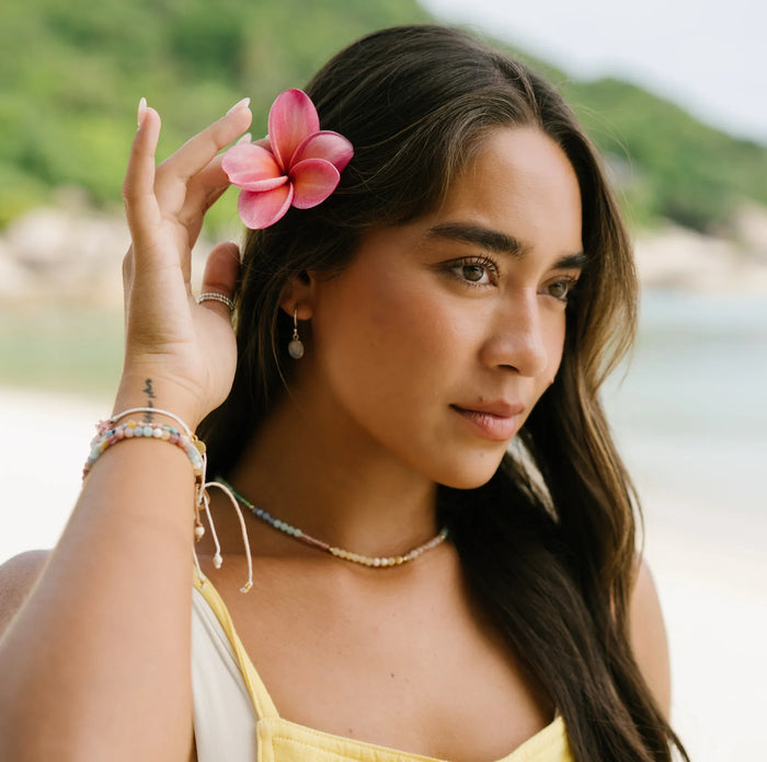 Model wearing  cosmic dreamer necklace and bracelet.