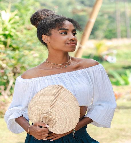 A woman is posing and looking to the right