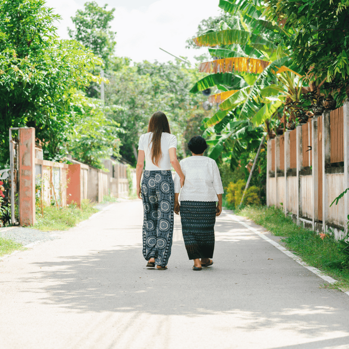 our ceo and head artisan walking in thailand together