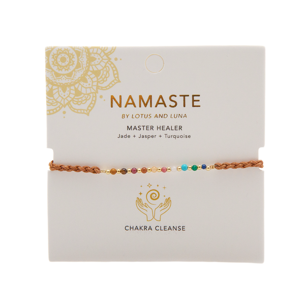 multicolor stone and gold bead bracelet on a brown cotton braided cord on packaging