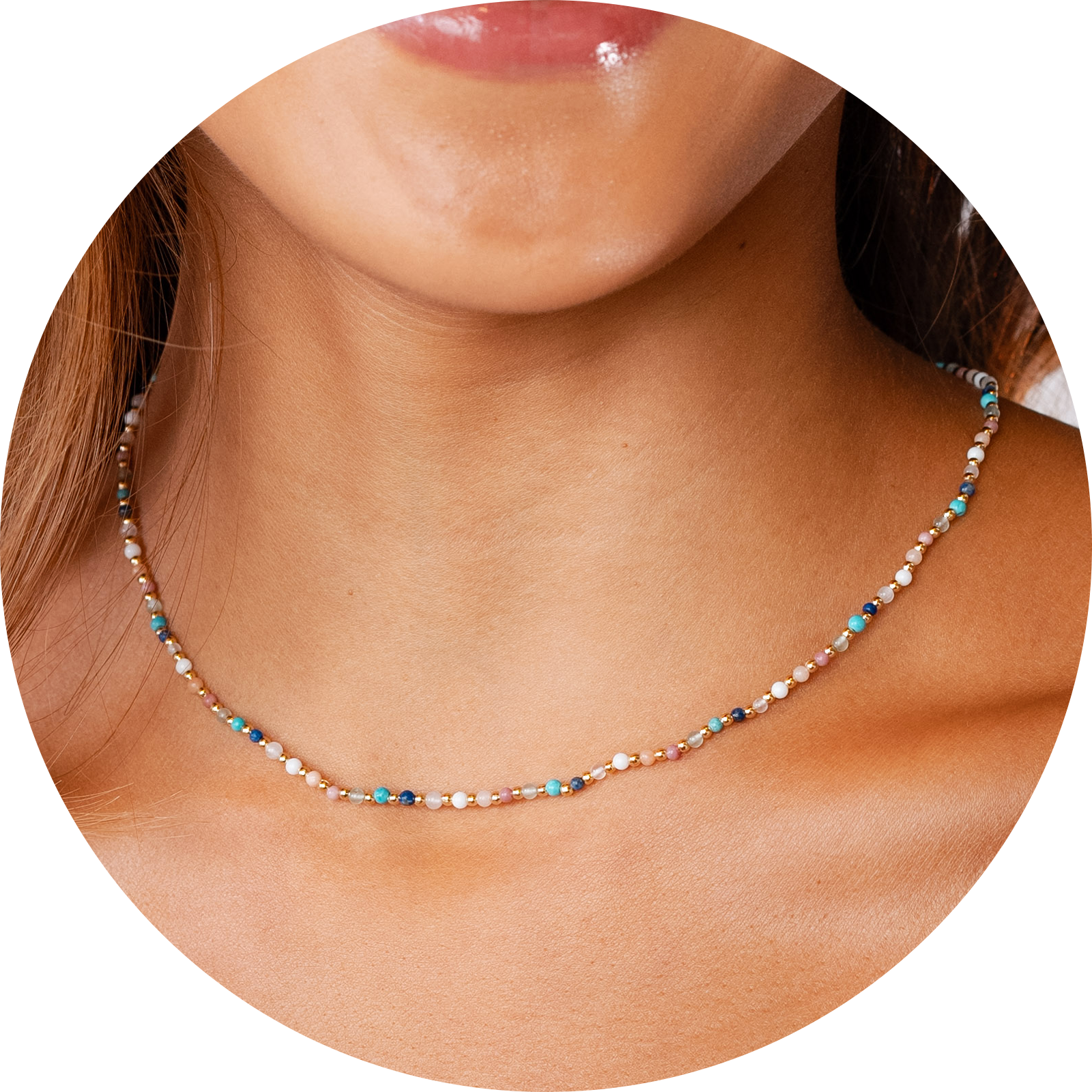 Model wearing a 2mm multicolor stone and gold bead healing necklace