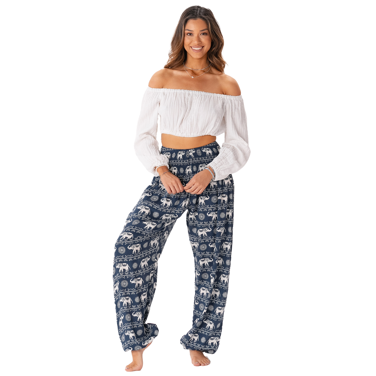 Model wearing navy harem pants with a white elephant stripe pattern