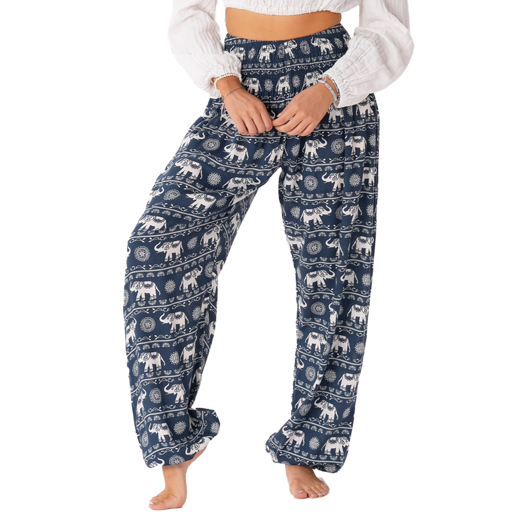 Model wearing navy harem pants with a white elephant stripe pattern