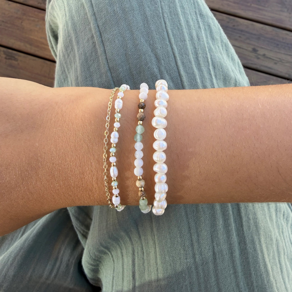 Self Love 4mm Healing Bracelet, stacked on wrist with green pants