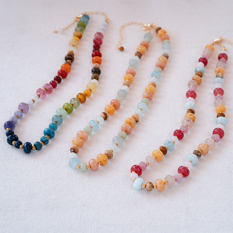 Move Mountains Statement Healing Necklace shown with two other necklace colors, flat lay